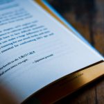 white book page on brown wooden table