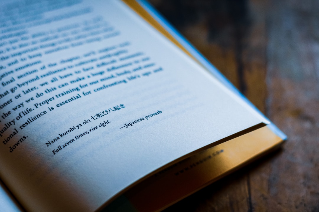 white book page on brown wooden table